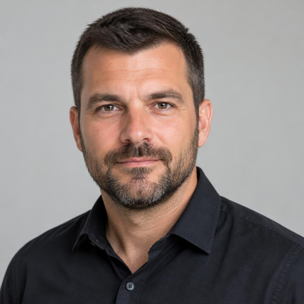 Portrait of a man with short hair and a beard